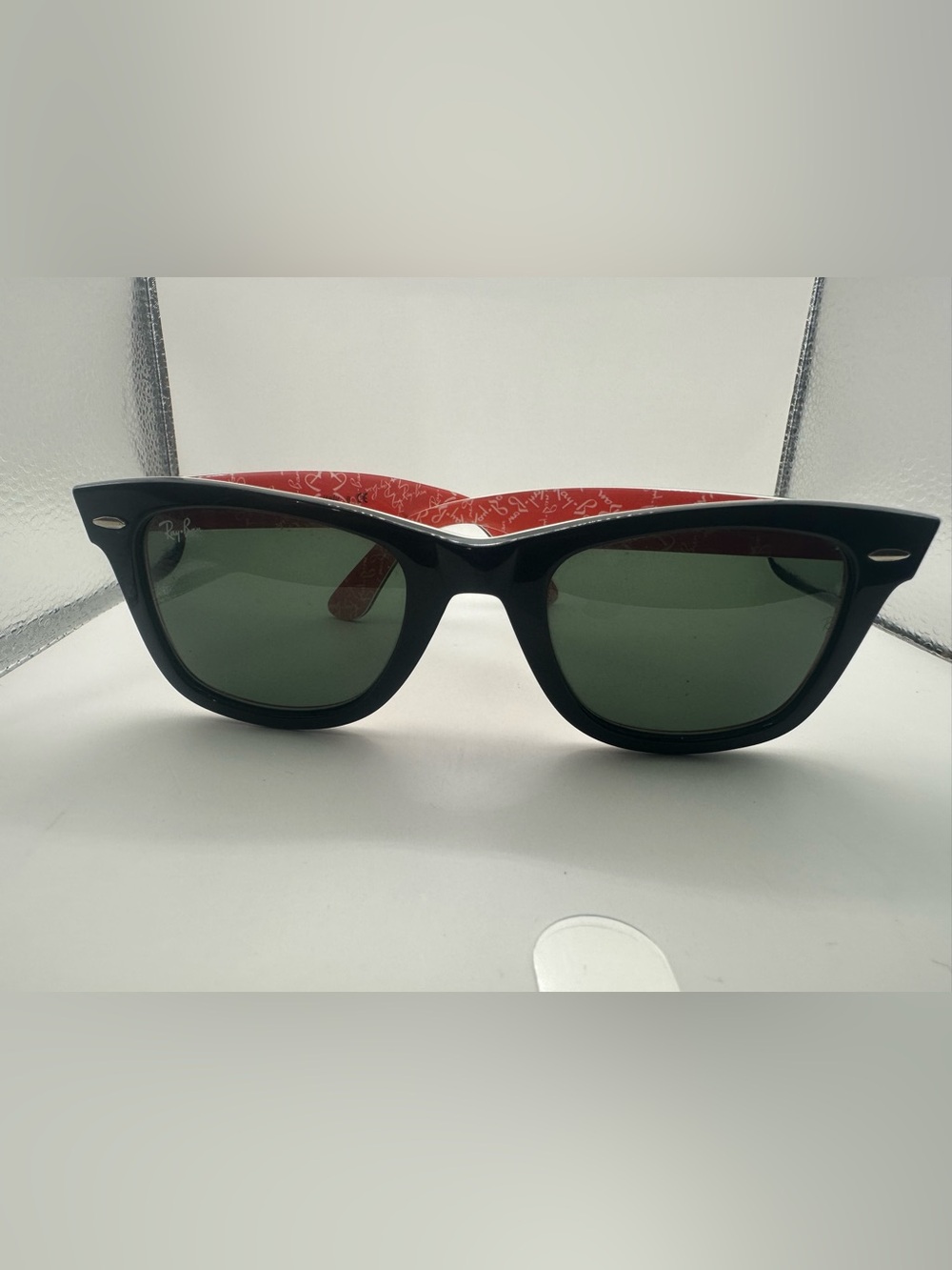 Ray-Ban Black Frame Sunglasses with Red Temples and Green Lenses